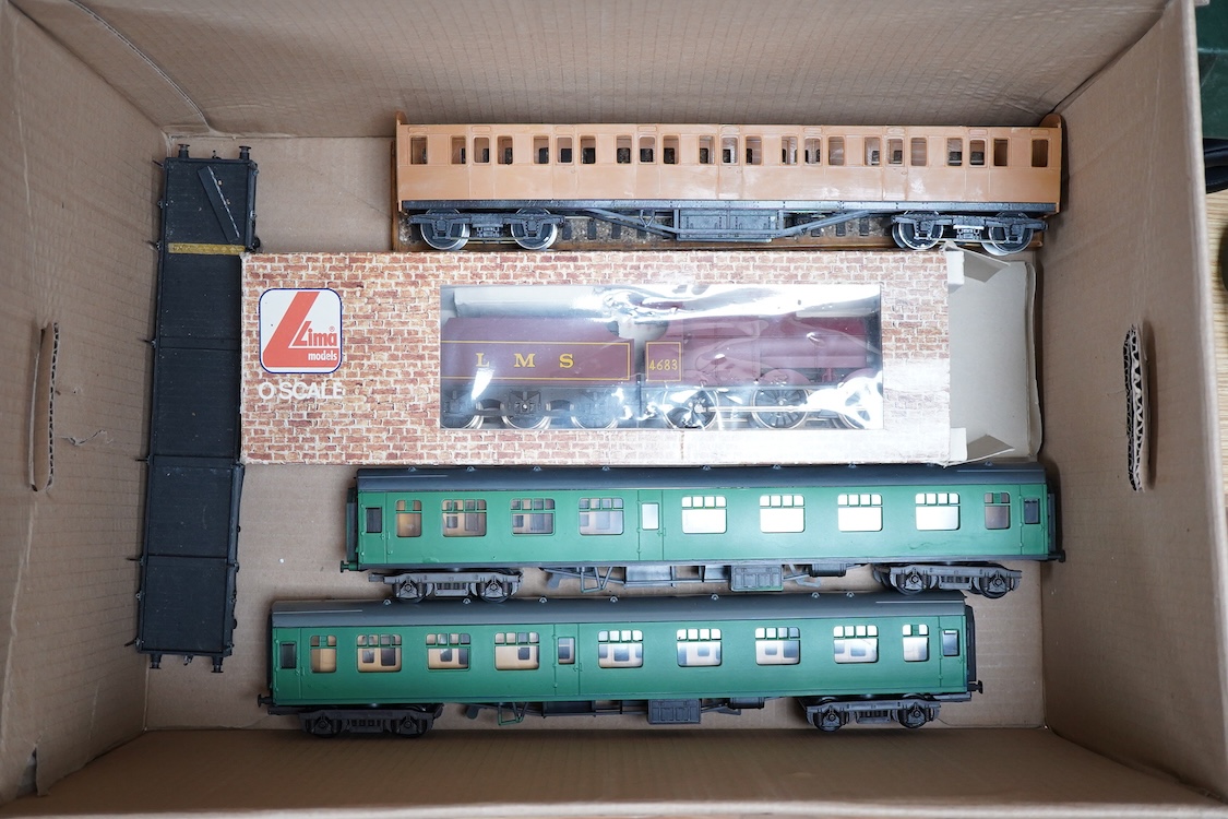 Eleven 0 gauge model railway items including; a bogie stake wagon, two mineral wagons, a North British coal wagon and two further open wagons, a partly constructed brake van, together with a Lima LMS 4F locomotive, two L